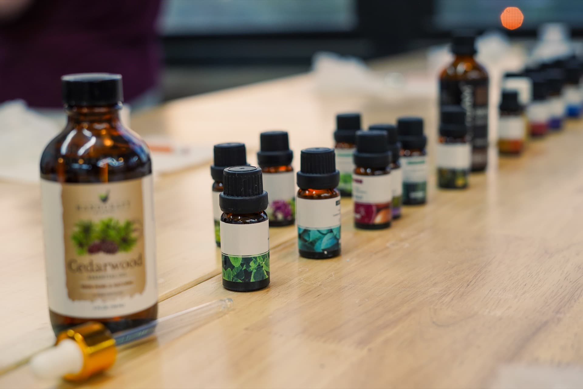 Row of perfume bottles and fragrance vials at the blending station